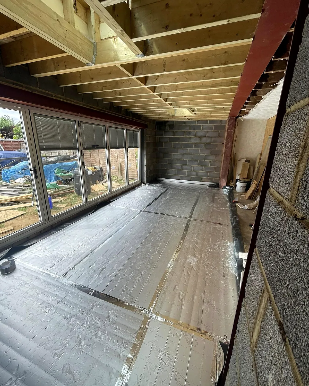 Insulated floor and bifold doors in