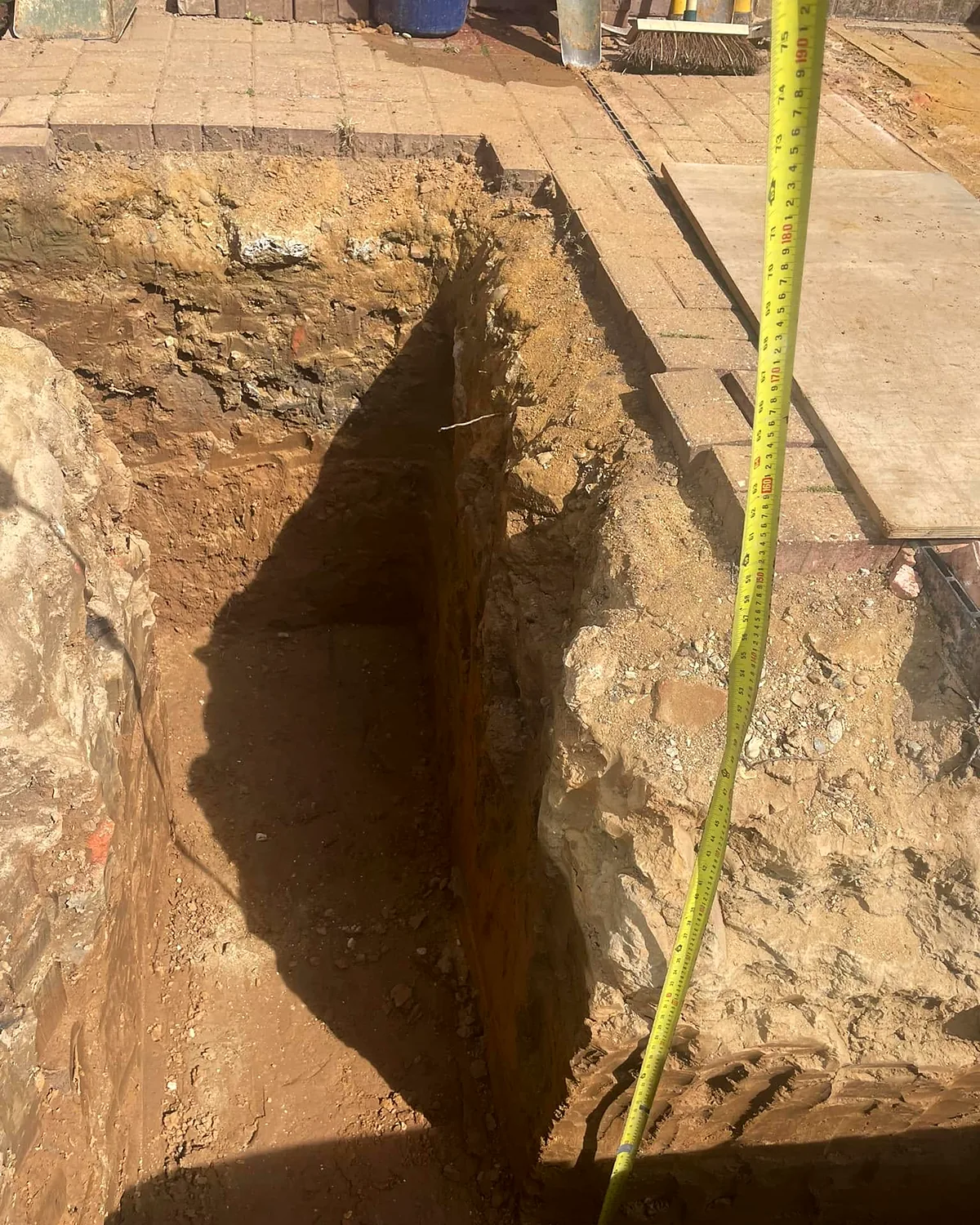 Footings: Trenches dug and measured before the concrete goes in.