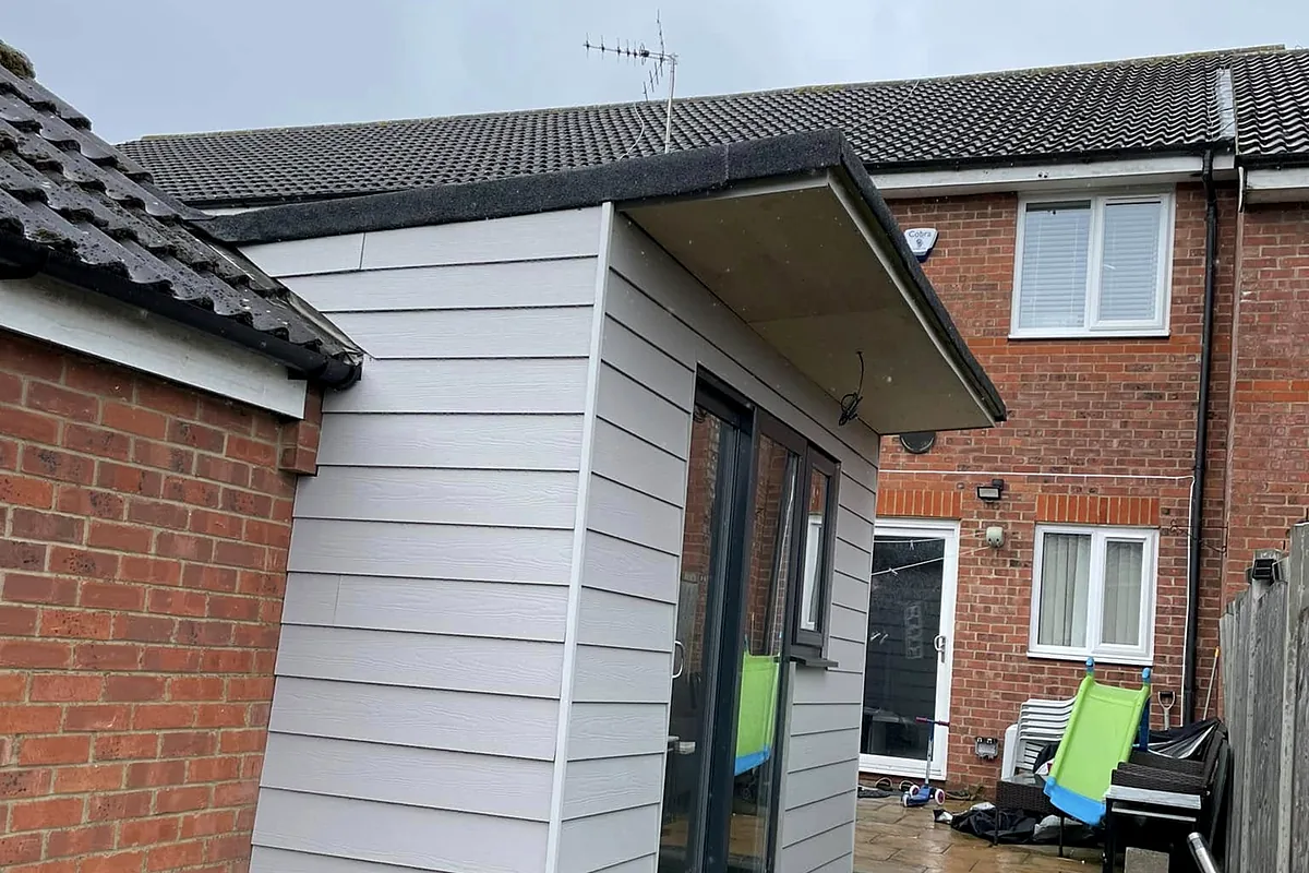 Cement board cladding on a garden room